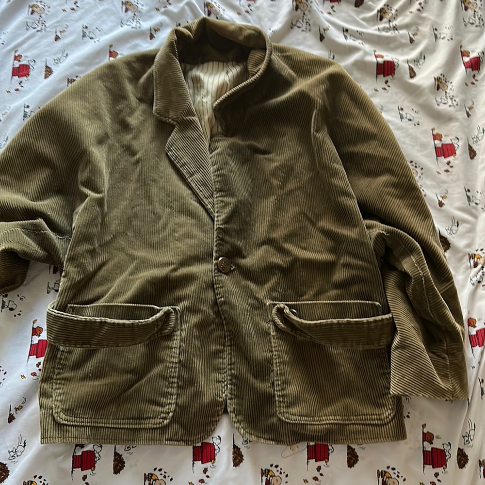 Jacket that i thrifted, no brand name small rip at the collar